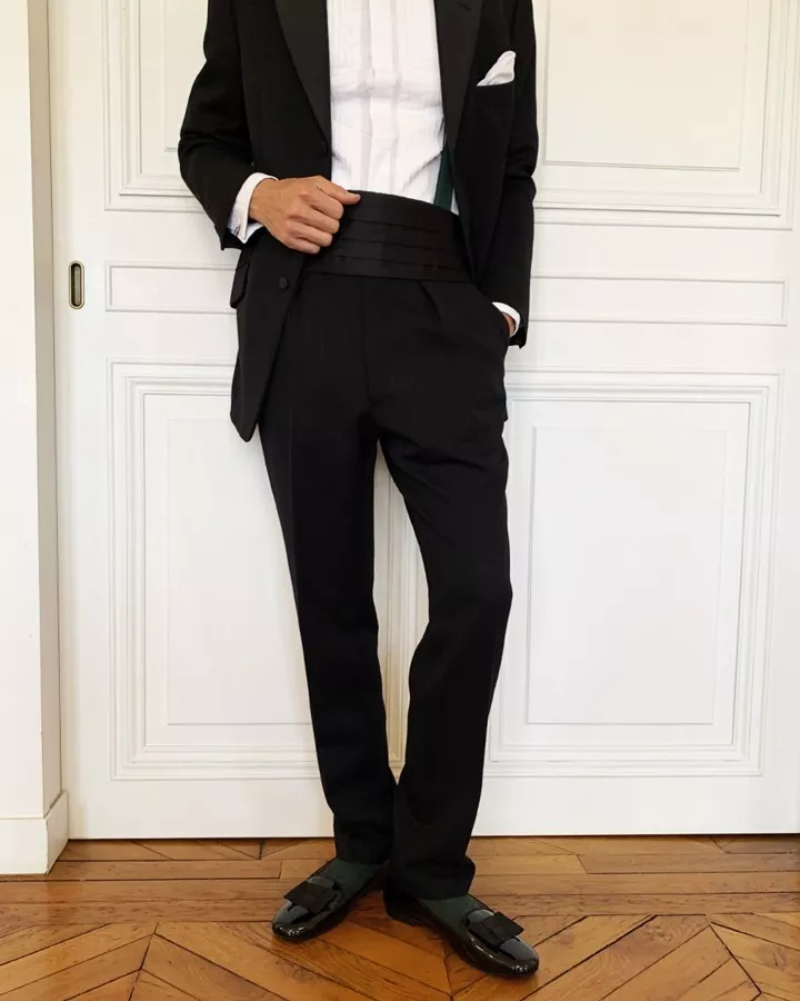 Men black tie pumps slippers with oversized bow worn by a men indoors 
