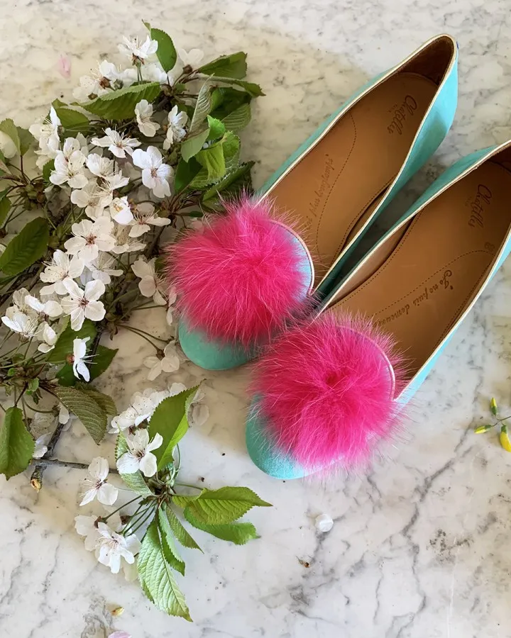 Pastel mint suede Slippers with yellow pompom surrounded by flowers
